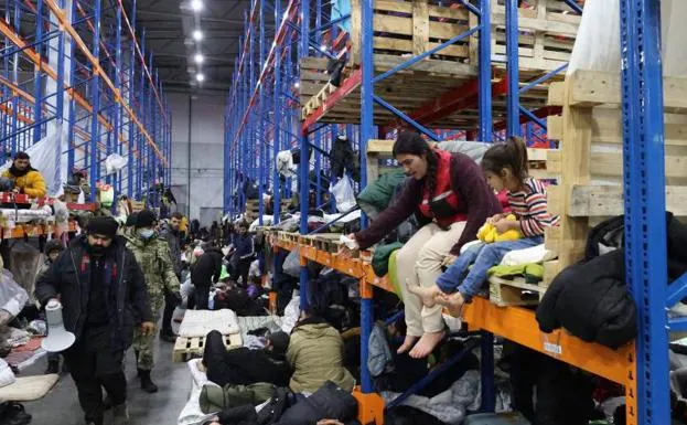 Migrants at a transport hub converted into a shelter in the Belarusian region of Grodno.