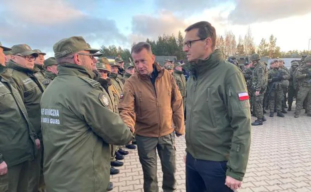Polish Prime Minister Mateusz Morawiecki visits troops at the border. 