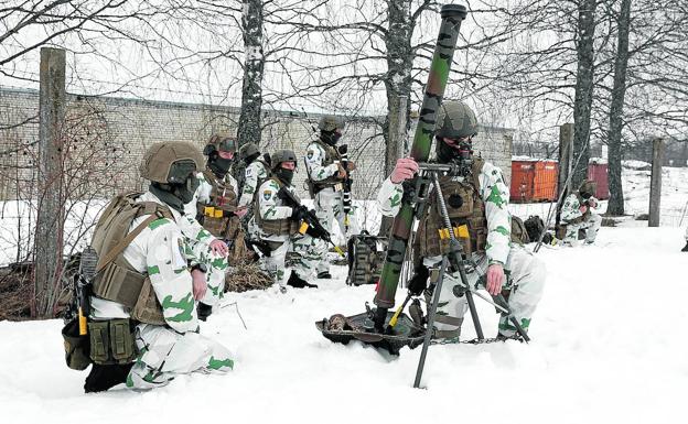 French soldiers from the 7th Alpine Hunters Battalion take part in a drill as part of the NATO deployment to Estonia. 