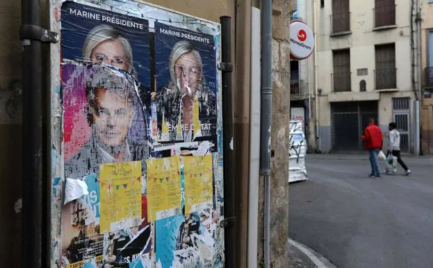Remains of the posters with the candidates for the last French elections, in a street in Perpignan.