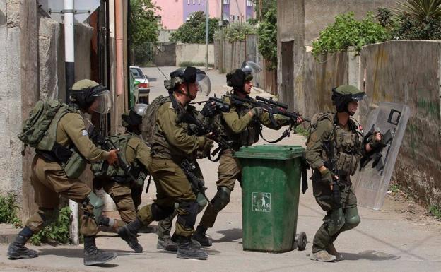 Israeli soldiers in Qalquilia, West Bank.