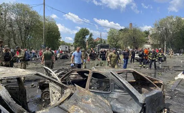 Emergency teams work at the site of the Russian missile attack in the city of Vinnitsa. 