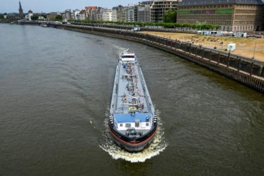 A boat sails down the Rhine in Düsseldorf, Germany. 