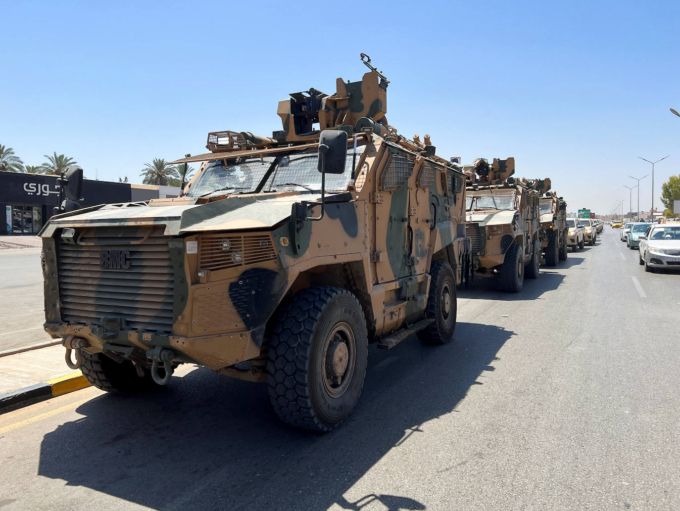 Military vehicles prepare to enter the conflict zone. 