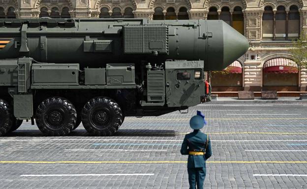 A Russian soldier stands guard over an intercontinental missile during a military parade in Moscow's Red Square in May.