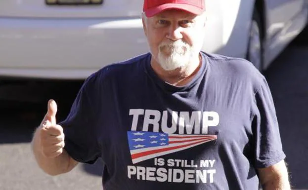 A man wears a shirt that reads 'Trump is still my president' as he arrives for a talk by the Republican candidate for governor of Pennsylvania in Feasterville-Trevose.