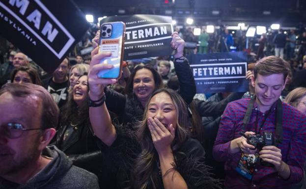 Supporters of Democrat John Fetterman celebrate his results.