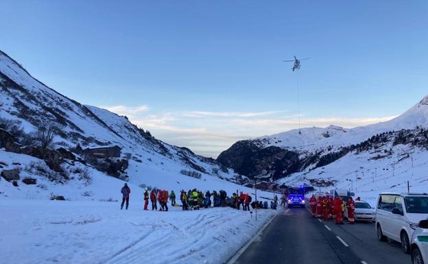 Emergency services work in the area where the avalanche occurred.
