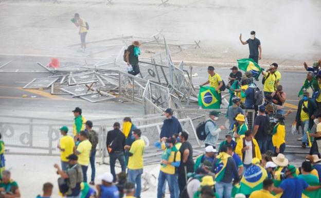 Supporters of former Brazilian President Jair Bolsonaro demonstrate against President Luiz Inacio Lula da Silva, outside the Brazilian National Congress in Brasilia. 